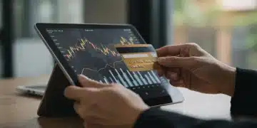 US Consumer Spending Decline: Q1 2025 Economic Impact Hand holding credit card viewing declining economic data on tablet, representing US consumer spending downturn.